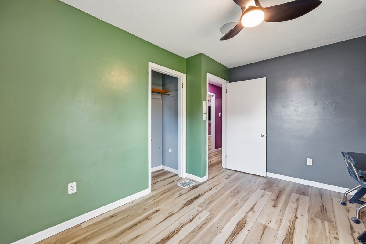 Bedroom showing closet and view to hallway