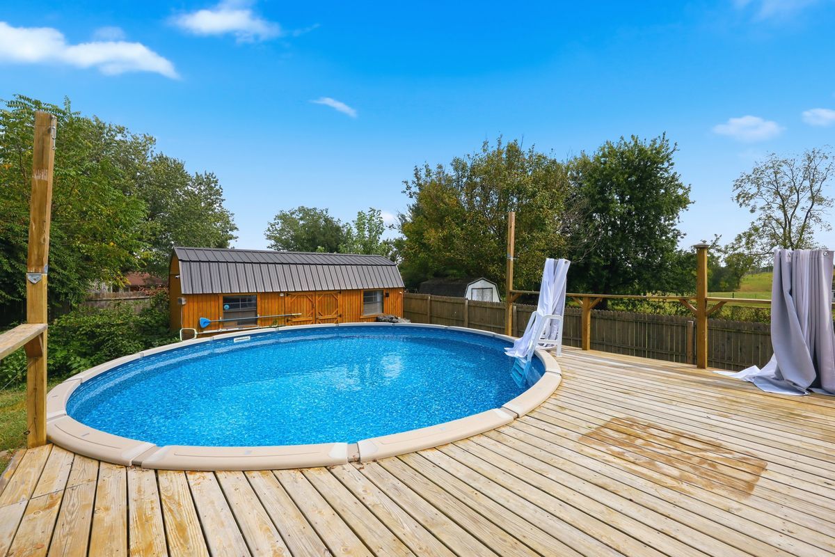 Above-ground pool with wrap-around deck