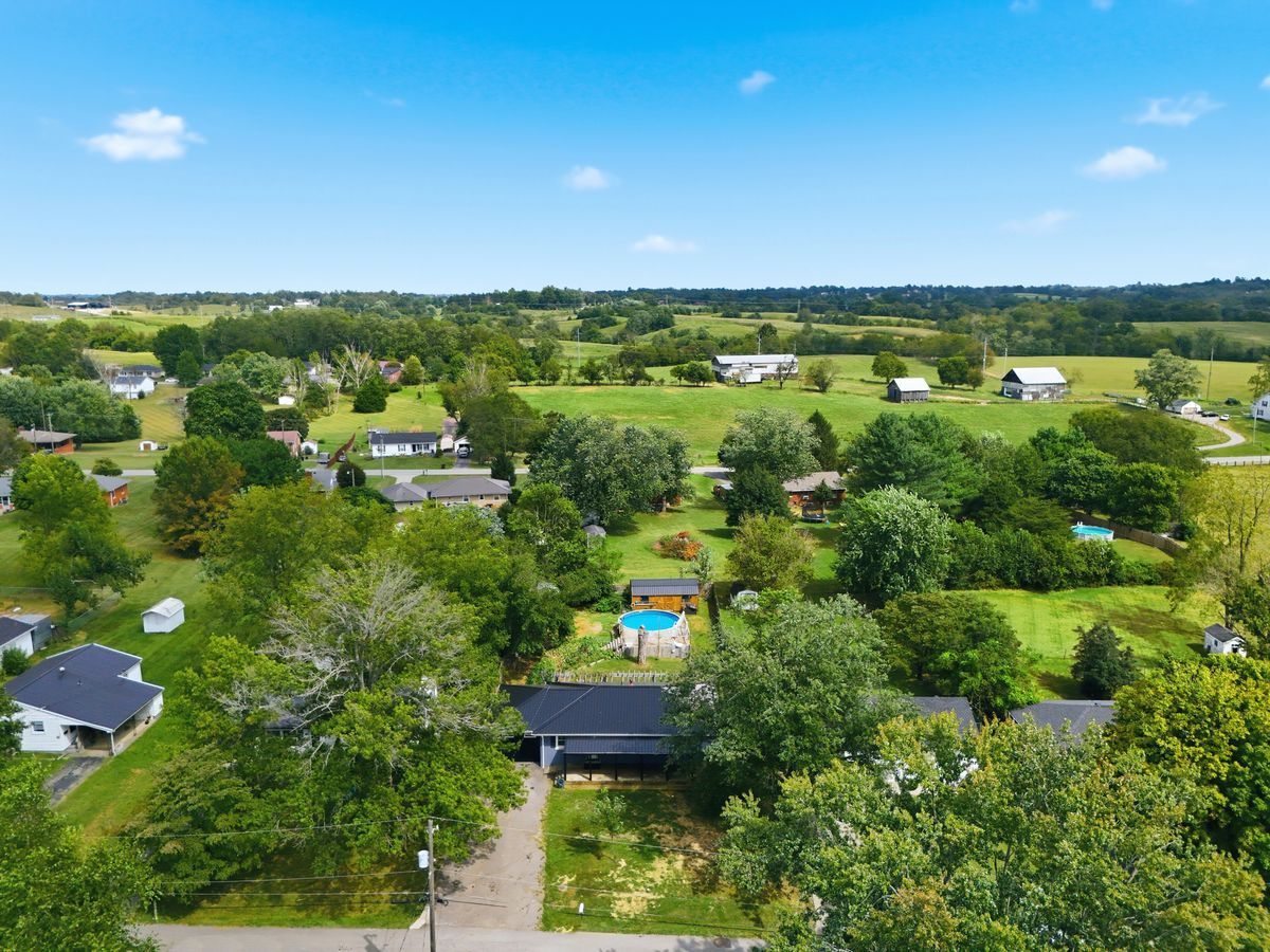 Aerial of property and Lancaster neighborhood with rolling countryside