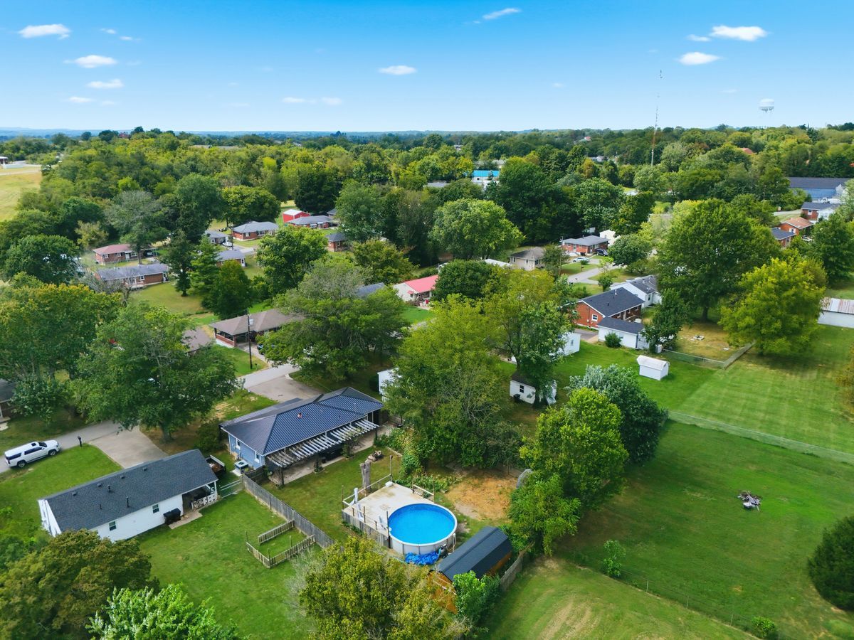Aerial looking over property toward surrounding farmland