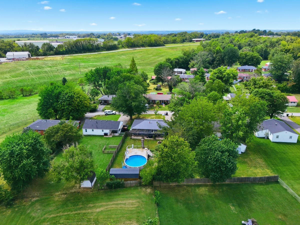 High aerial of property and pastures on edge of Lancaster