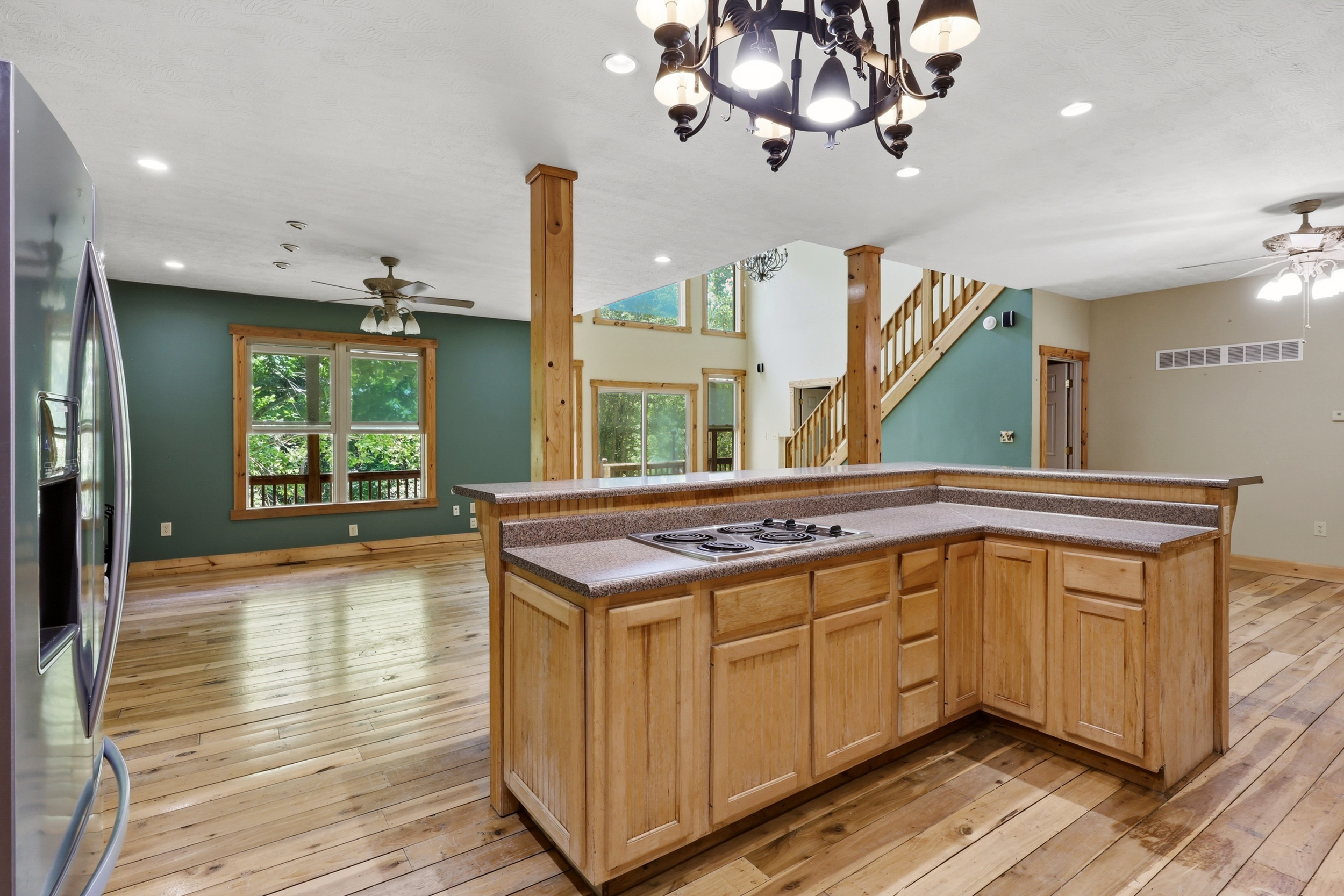 Kitchen island with cooktop looking toward living room