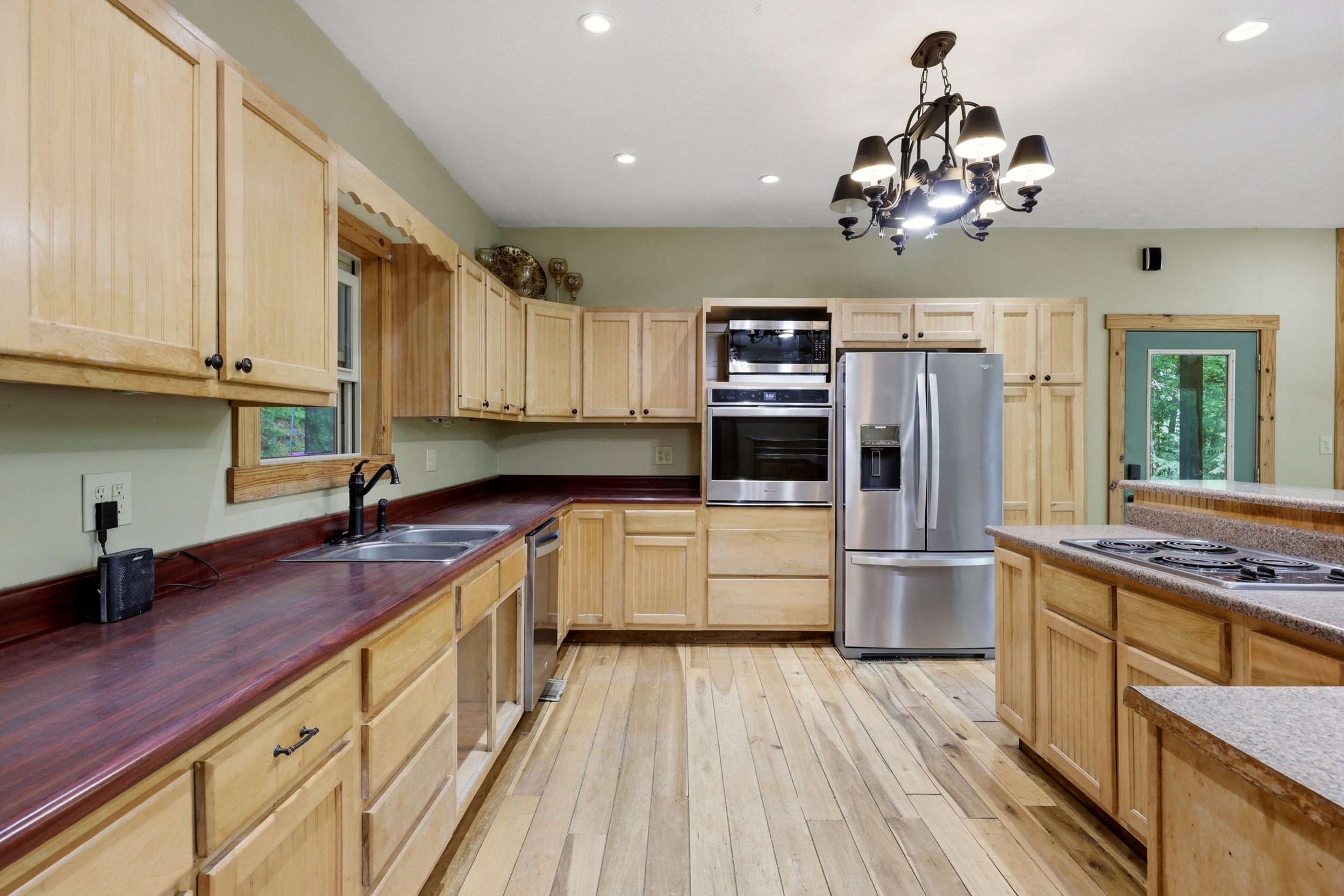 Kitchen with stainless appliances and pull-out drawers