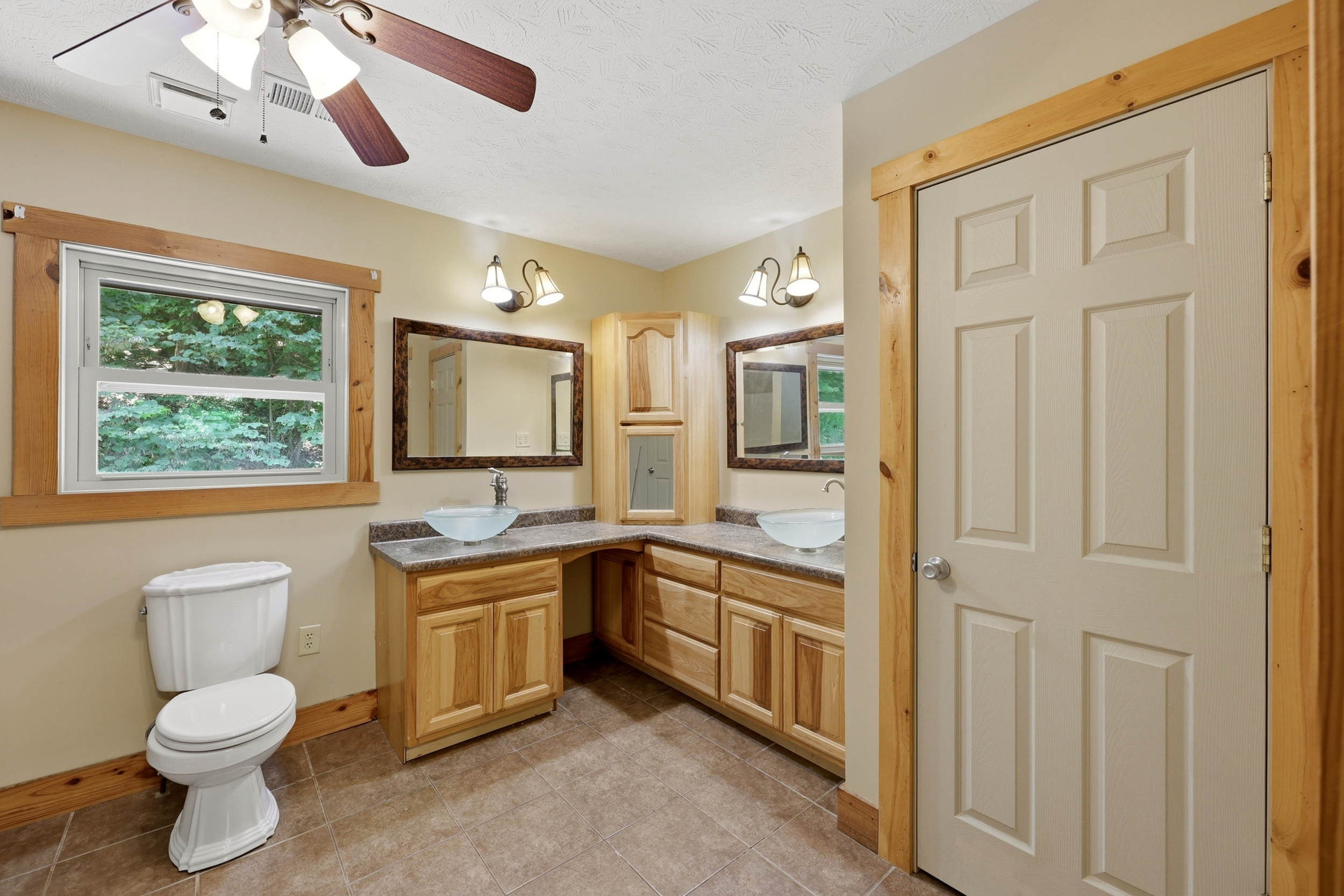 Double vanity bathroom with vessel sinks