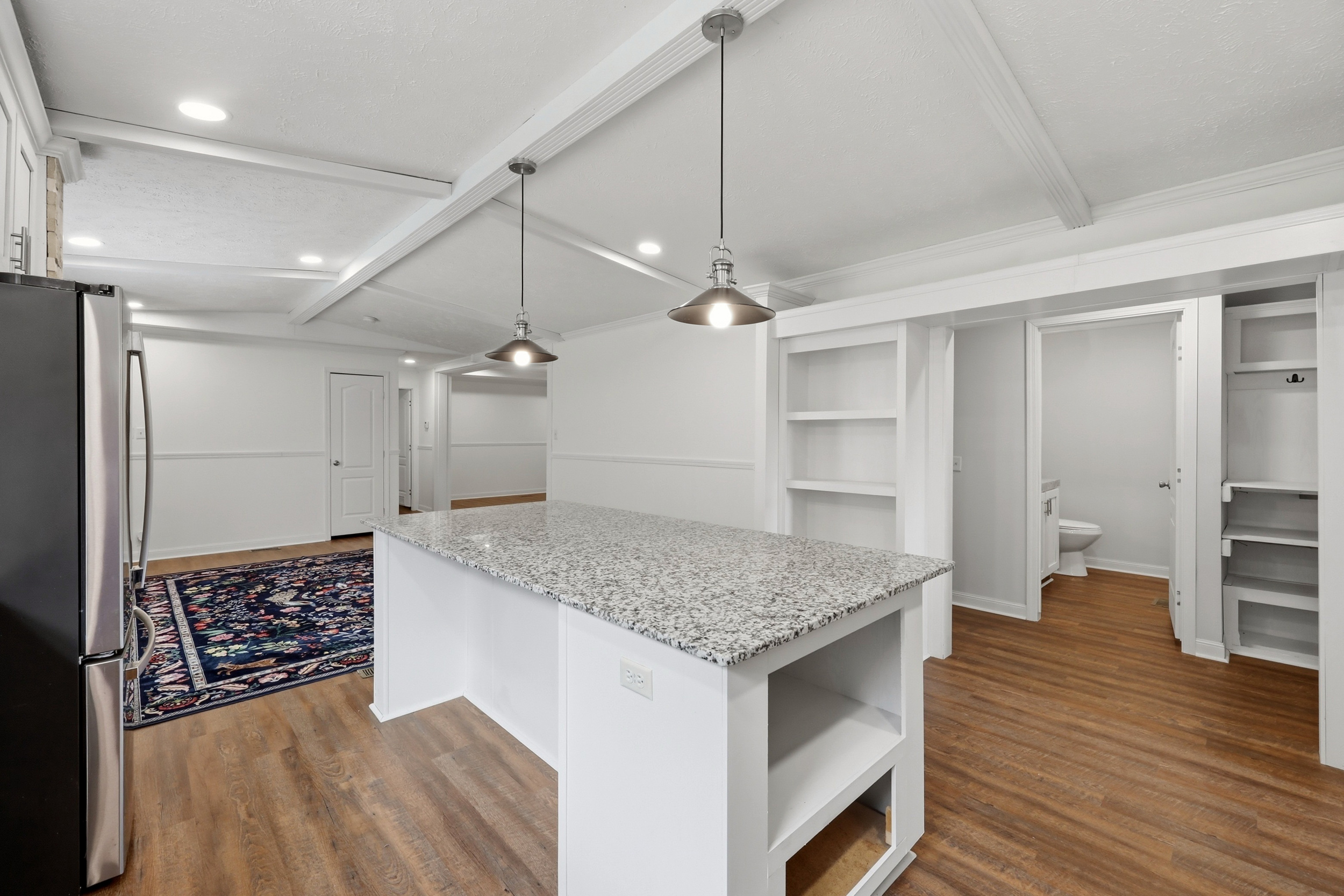 Kitchen island with pantry and built-in shelving