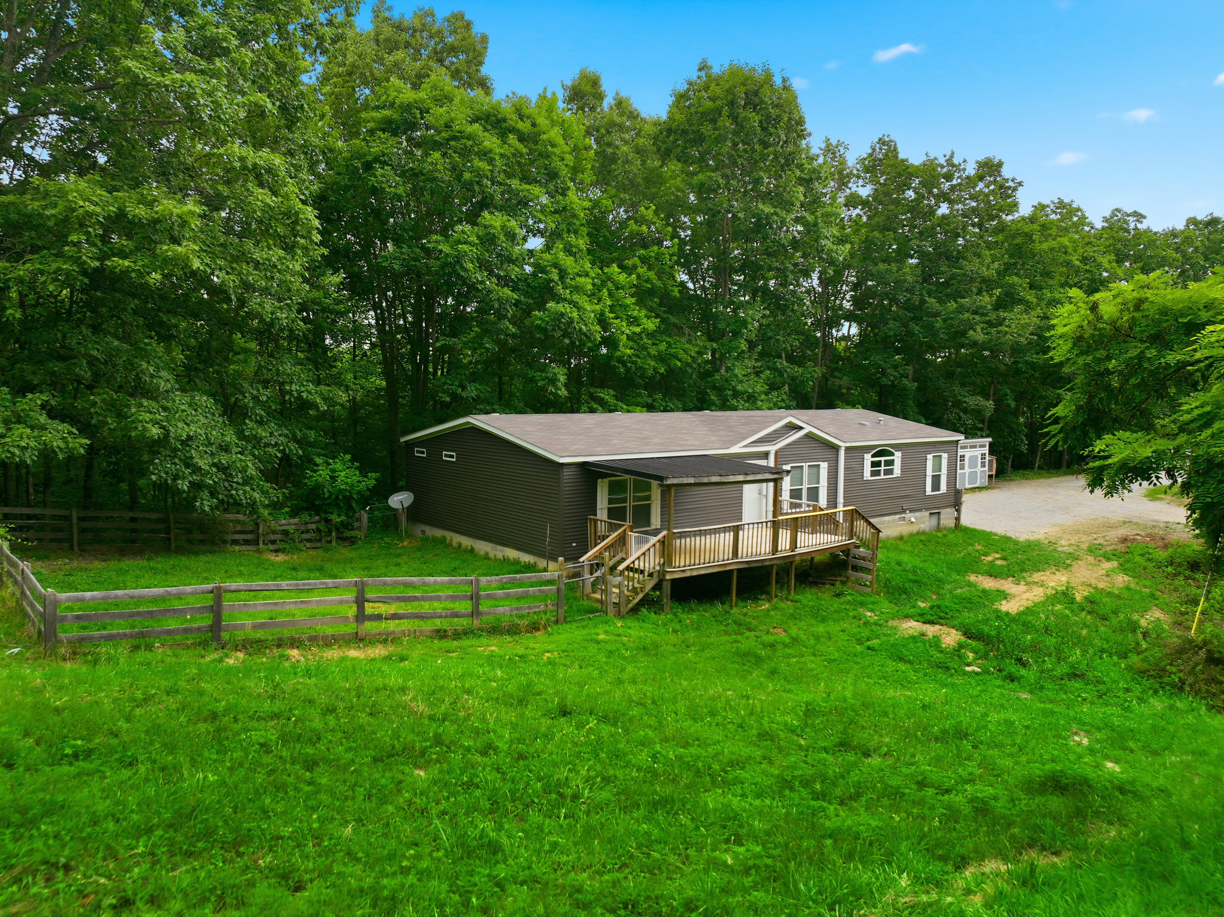 Aerial view of main home and pasture