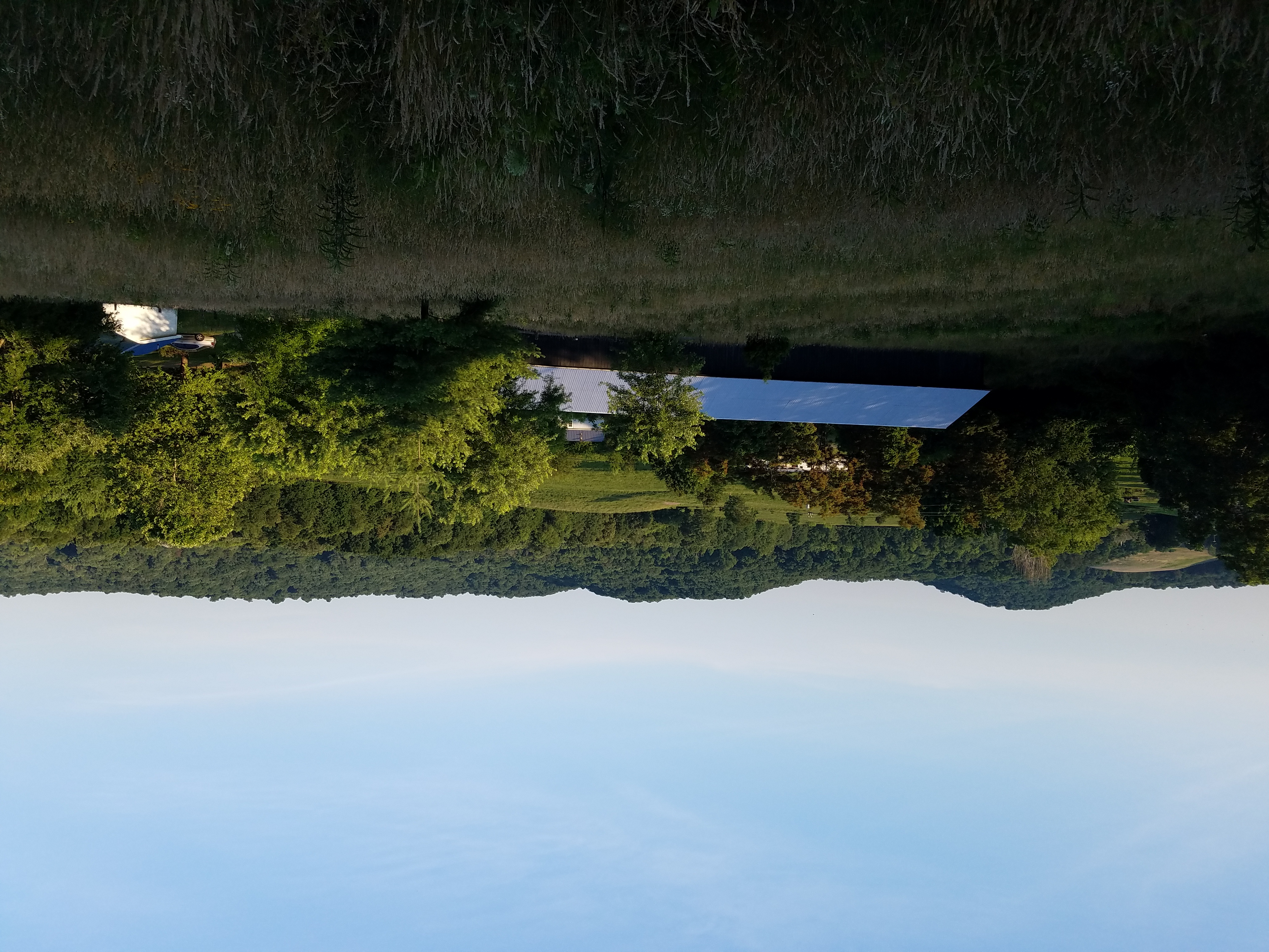 Barn and pasture with pond view