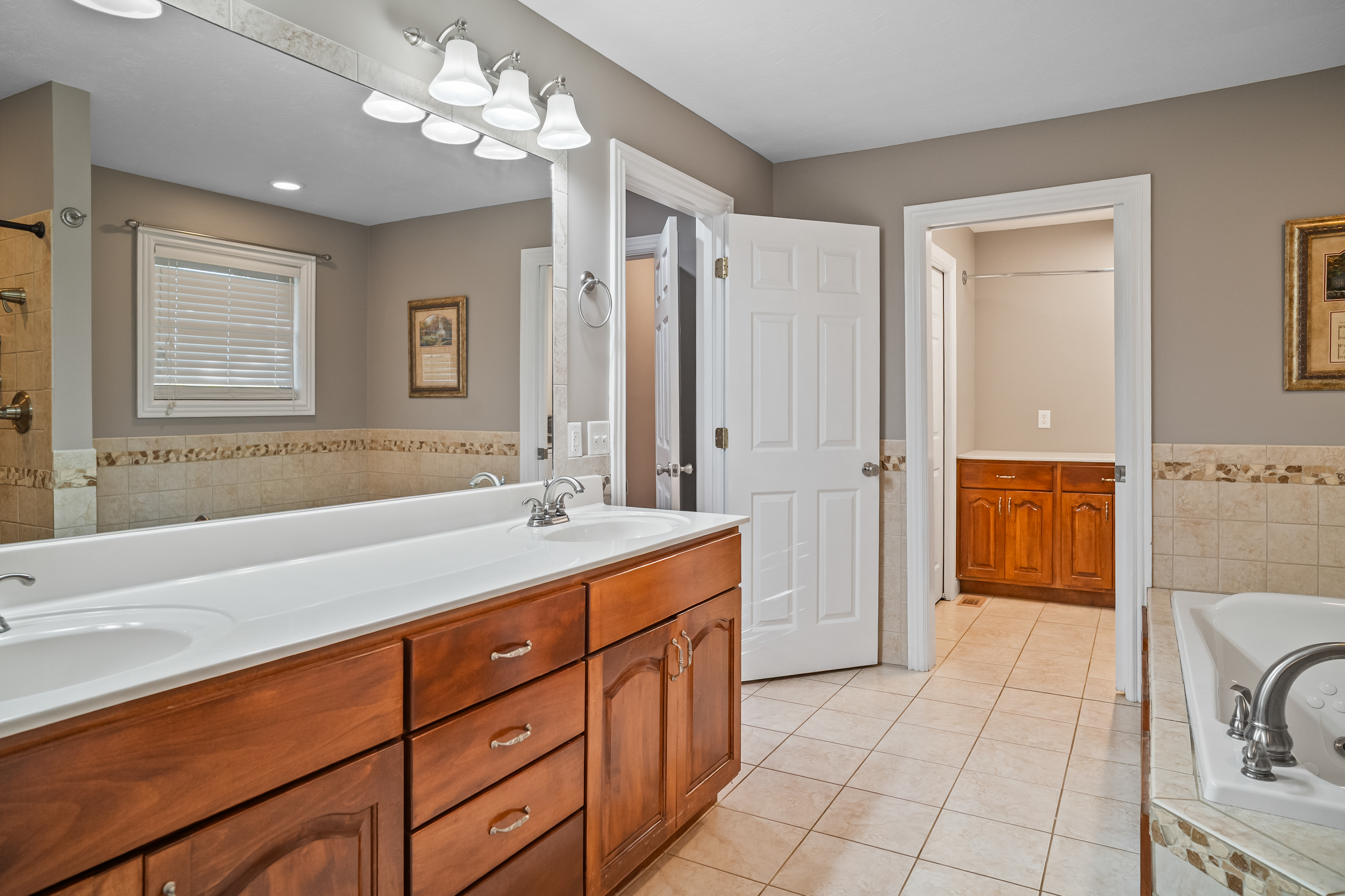 Primary bedroom with tray ceiling