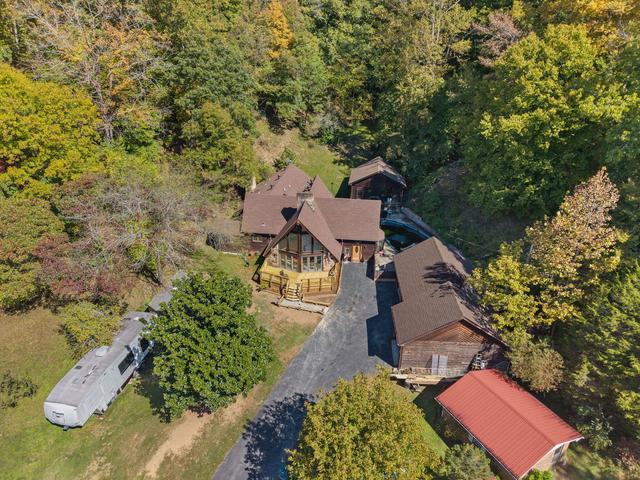 Wide aerial view of the 11-acre property from above