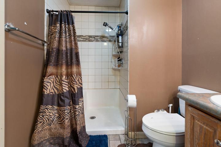 Upstairs full bath with comfort-height toilet and grab bars