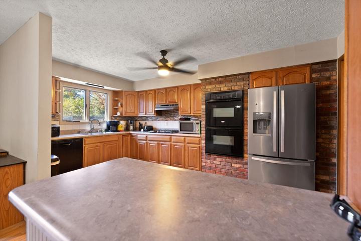 Kitchen with cabinetry and countertops