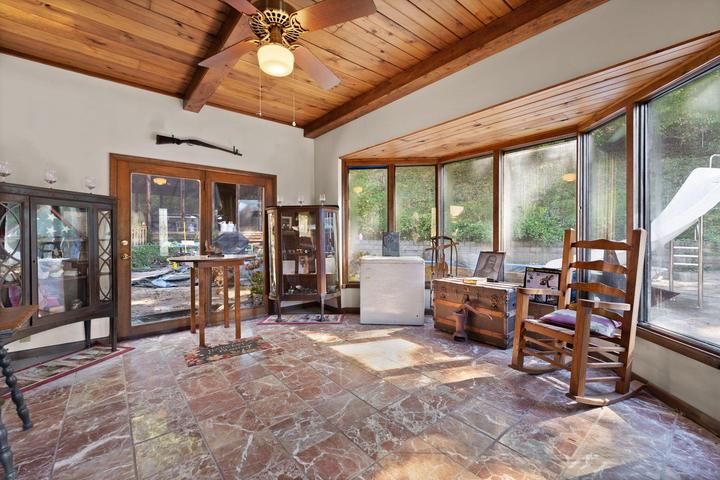 Sunroom entry with natural light and plants