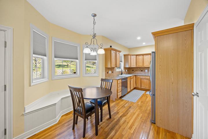 Dining area adjacent to kitchen with natural light