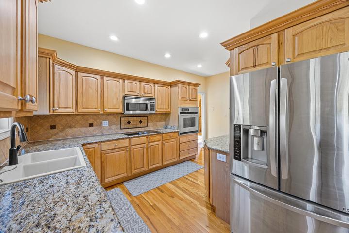 Hallway or entry with hardwood floors and trim detail