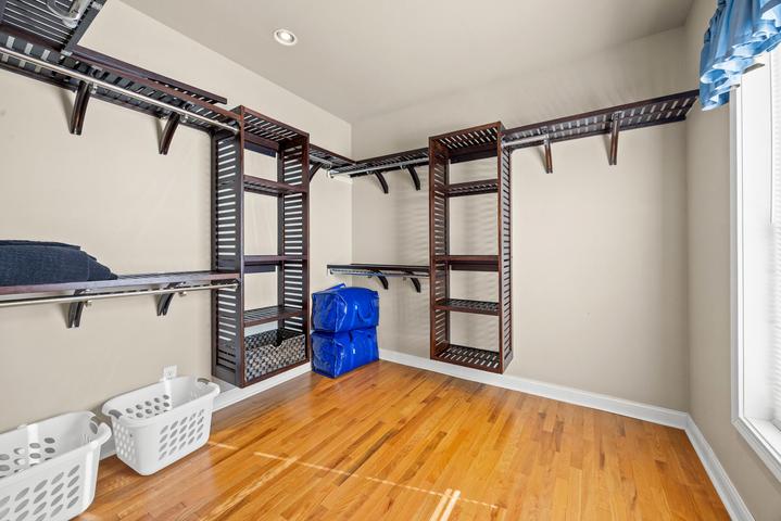 Spacious walk-in closet in primary suite