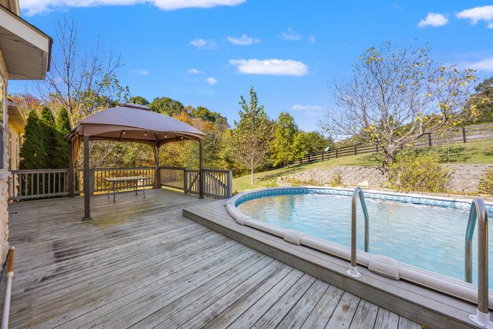 Wraparound porch overlooking the rolling acreage