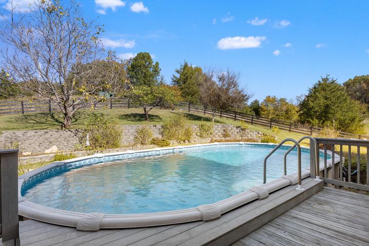 Pool area from a second angle with landscaping