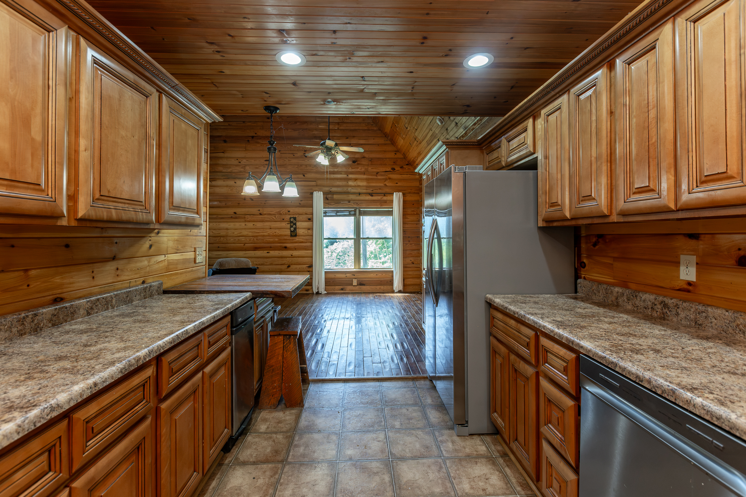 Sunroom or office with windows and log walls