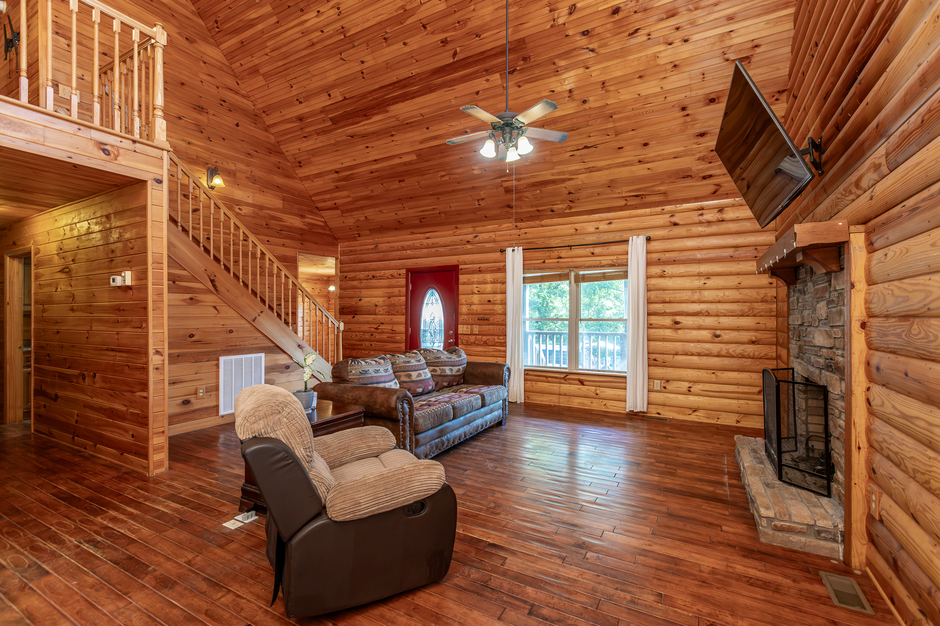 Living area with log walls and natural light