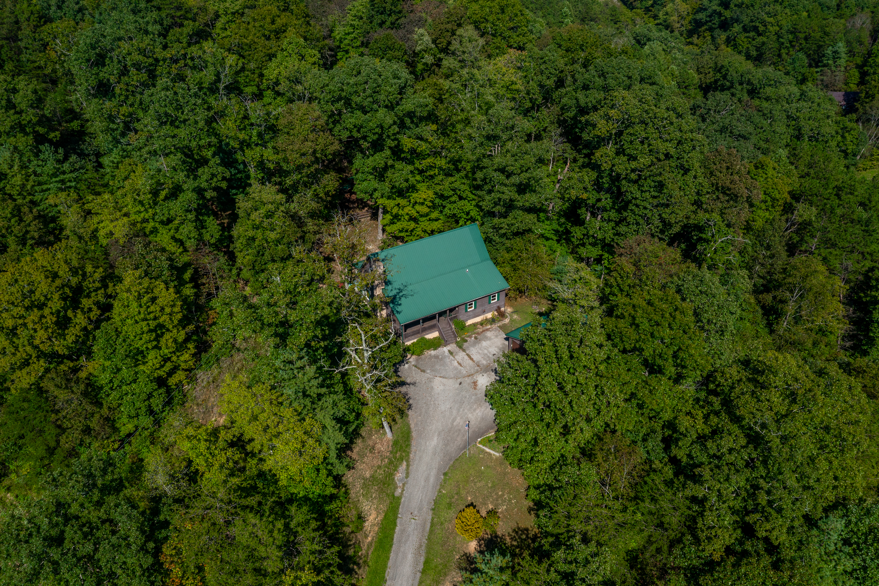 Aerial view of property and detached garage